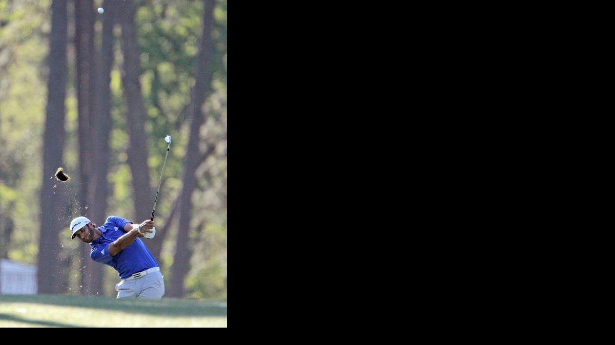 
Dustin Johnson hits his approach on No. 17 during first round action of the Masters Tournament at Augusta National Golf Club in 2014.
