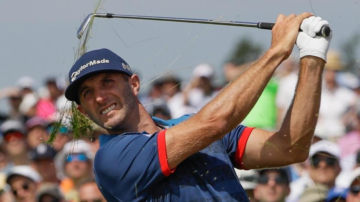 Dustin Johnson hits out of the fescue on the 17th hole during the first round of the U.S. Open golf tournament Thursday, June 15, 2017, at Erin Hills in Erin, Wis.