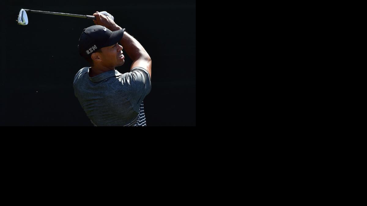 
Tiger Woods hits from the 16th tee during the third round of the Masters at Augusta National Golf Club on Saturday, April 11, 2015, in Augusta, Ga. 
