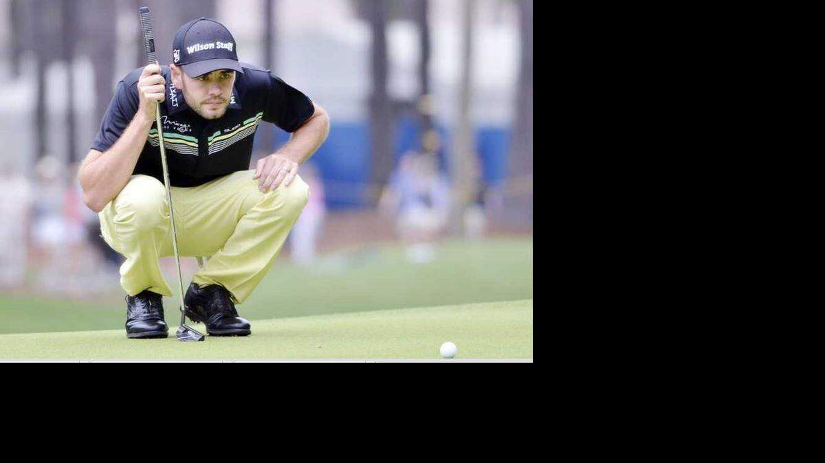 
Troy Merritt sizes up a putt on No. 1 during the third round of the RBC Heritage Presented by Boeing golf tournament, held on Saturday, April 18, 2015 at Harbour Town Golf Links on Hilton Head Island, S.C. Merritt was defending his lead a day after setting the Harbour Town course record.

