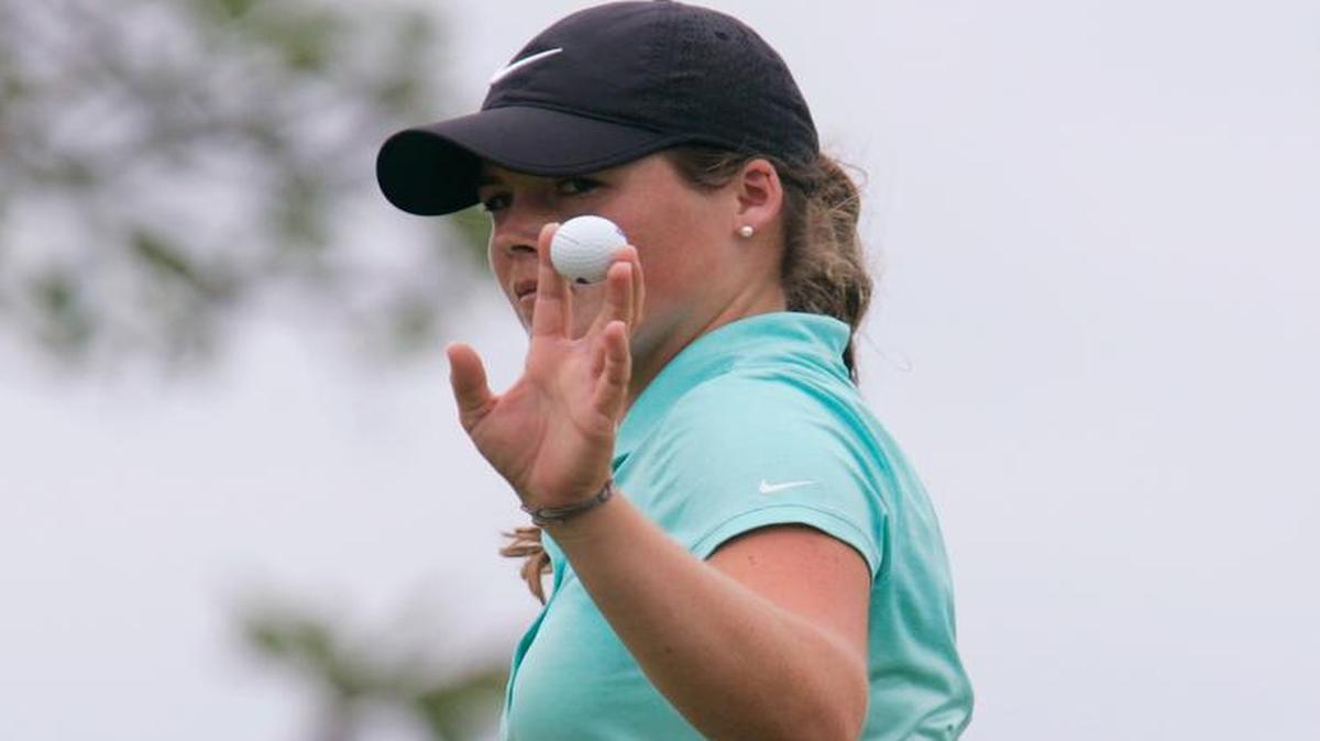 Katie Burnett waves to the gallery after putting on the first green during the final round of the Lotte Championship LPGA golf tournament in April in Kapolei, Hawaii.