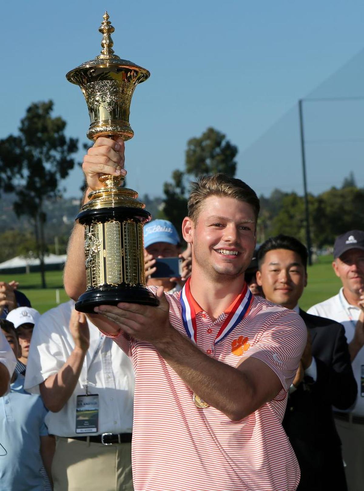 Doc Redman holds the Havemeyer Trophy after winning the USGA Amateur Golf Championship at the Riviera Country Club in the Pacific Palisades area of Los Angeles, Sunday, Aug. 20, 2017.
