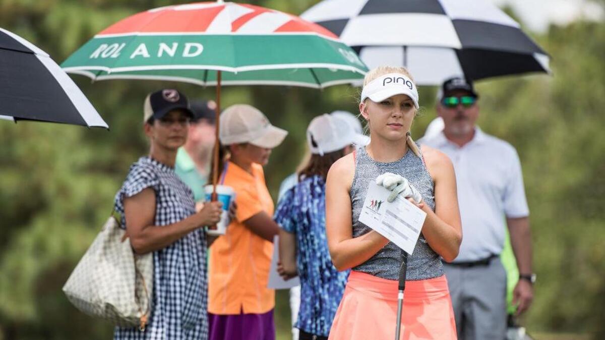 A golfer waits her turn at the driving range during the annual Drive-Chip-Putt competition at the Fort Jackson Golf Club on August 26, 2017, in Columbia. The event provides a chance for young golfers to win a trip to compete at Augusta National.