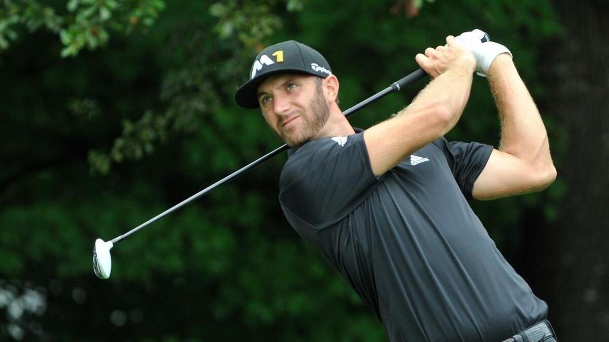 
Dustin Johnson tees off on the third hole during the second round of the Tour Championship.
