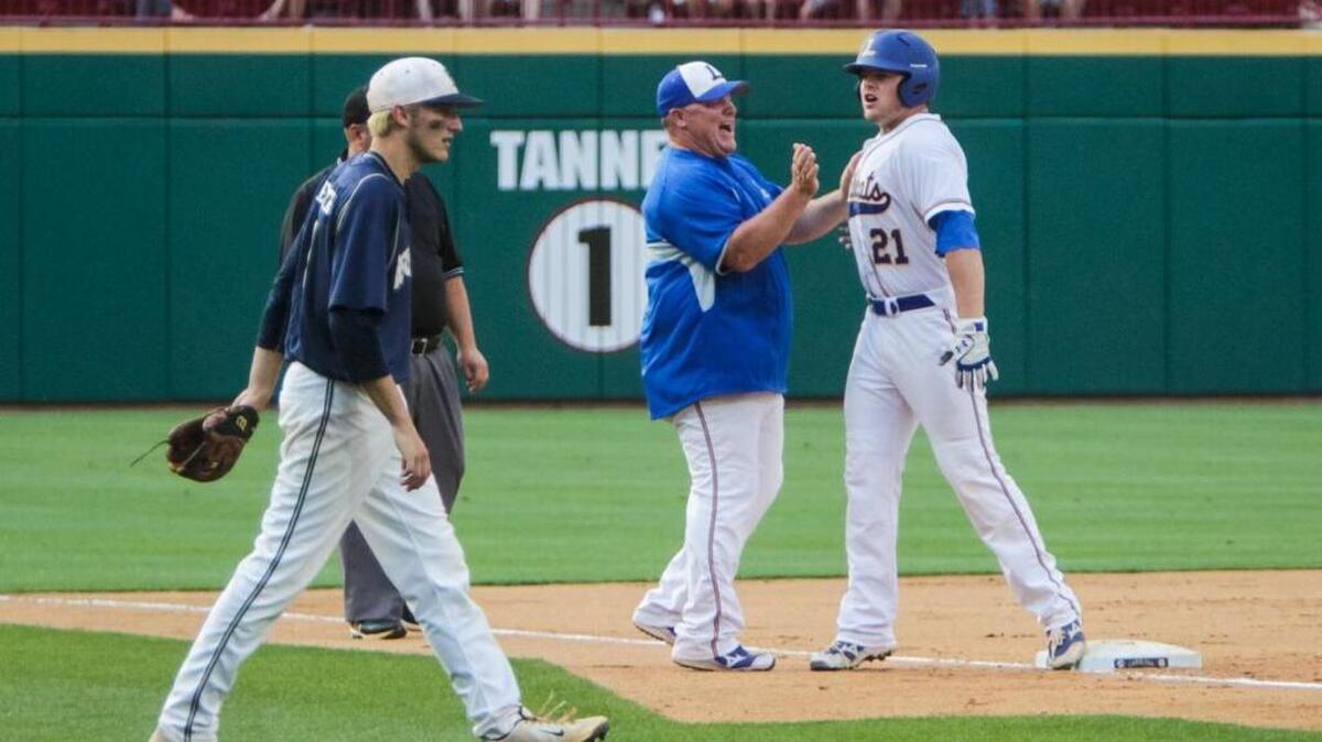 Lexington coach Brian Hucks, center