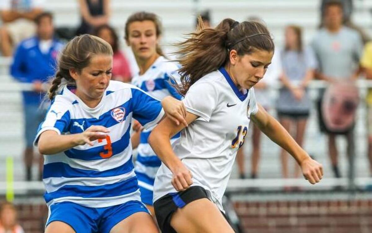 Lexington’s Brooke Power dribbles past James Island’s Charter High School's Maddy Chamness during the Lower State championship game.