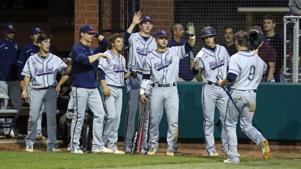 White Knoll celebrates a run scored by Zach Driggers on Monday against River Bluff.