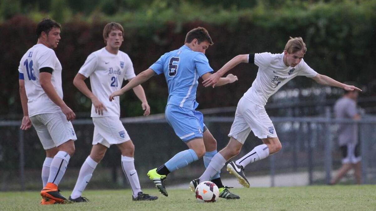 FILE: Dreher's Ian Devlin (5) and Chapin's Ethan Dawsey (6) battle for the ball.