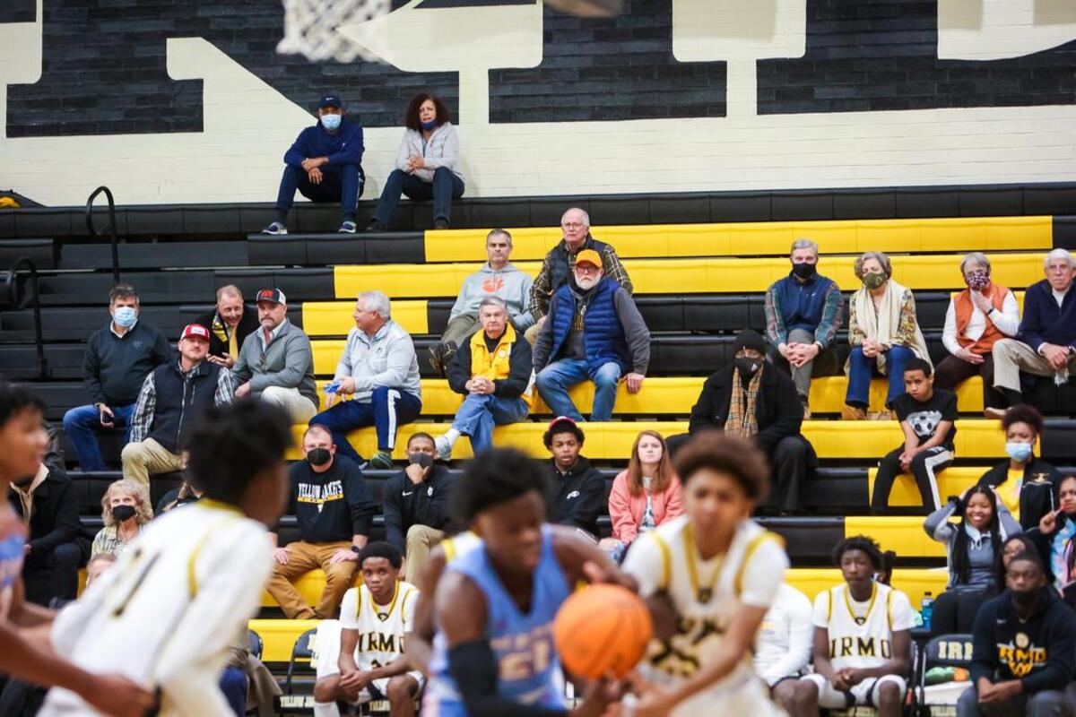 Fans watch the game between the A.C. Flora Falcons and Irmo Yellowjackets during their game at Irmo High School Friday evening, January 14, 2022.