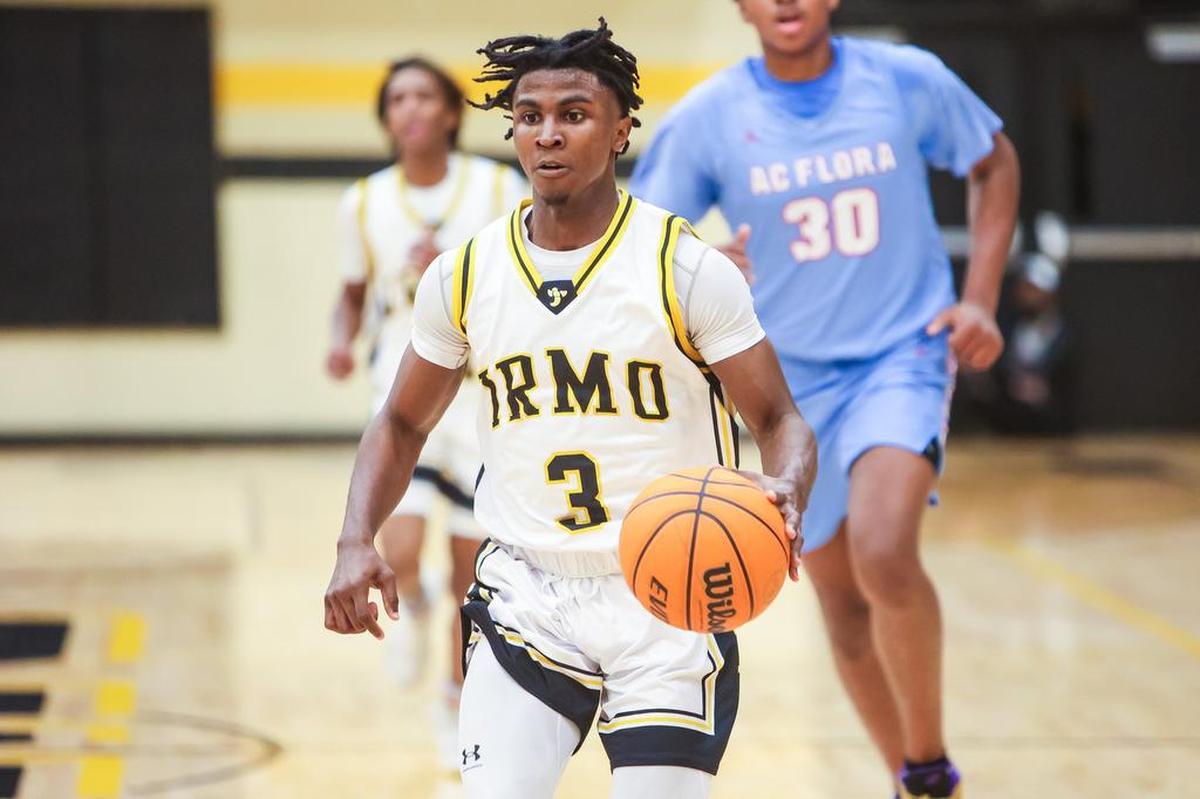 Irmo Yellowjackets guard Dylan Williams (3) brings up the ball against the A.C. Flora Falcons during their game at Irmo High School Friday evening, January 14, 2022.