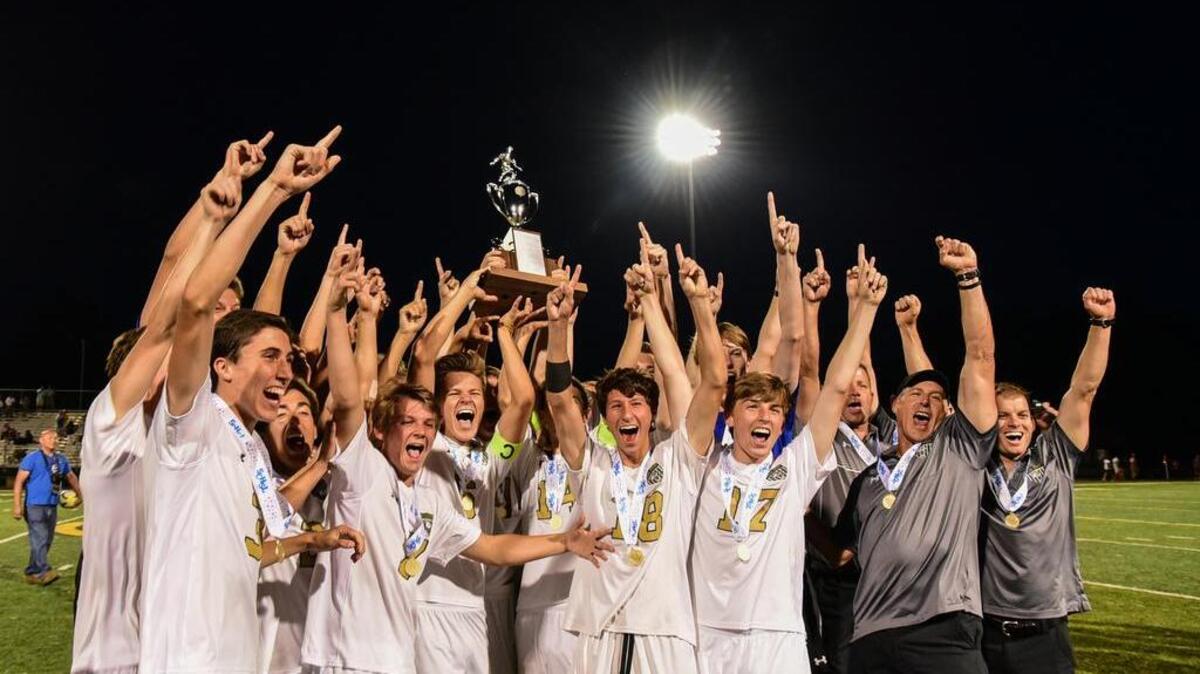River Bluff players and coaches celebrate after their state championship win of 5-0 against Clover.
