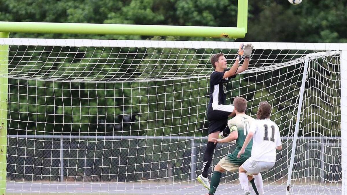 Socastee's Chris Matlashewski (11) watches as River Bluff's Evan Dowdy blocks a shot in the match on Tuesday. River Bluff won 2-0 and advances to the state title game.