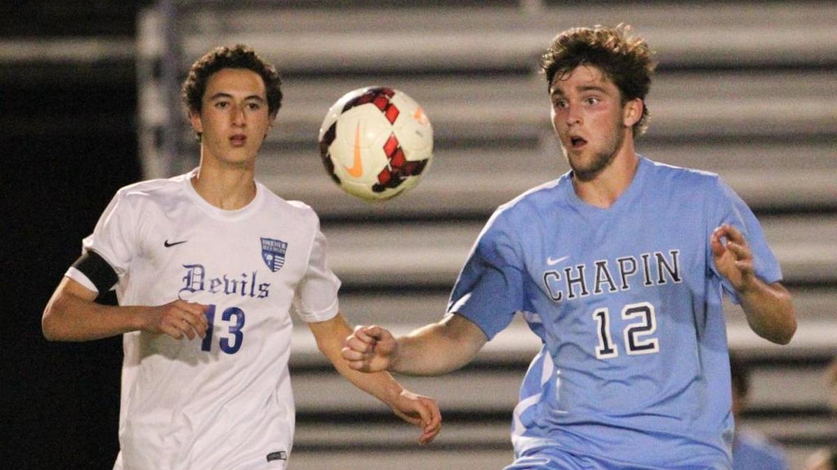 Dreher's Rodrigo Belchior (13) and Chapin's Smith Dawsey (12) try for the ball during the final half game action at Memorial Stadium. Dreher won in overtime, 3-2.
