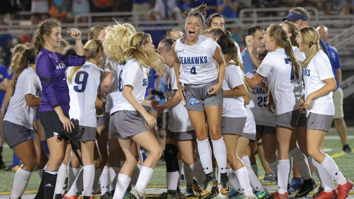 Hilton Head celebrates after winning the Class 4A girls’ soccer state championship at Irmo High School. 5/11/18