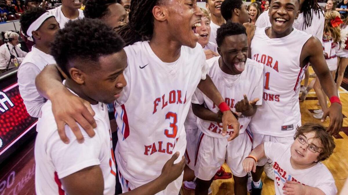 A.C. Flora High School players celebrate following their win over Midland Valley High School in the 3A Boys State Championship game at Colonial Life Arena.