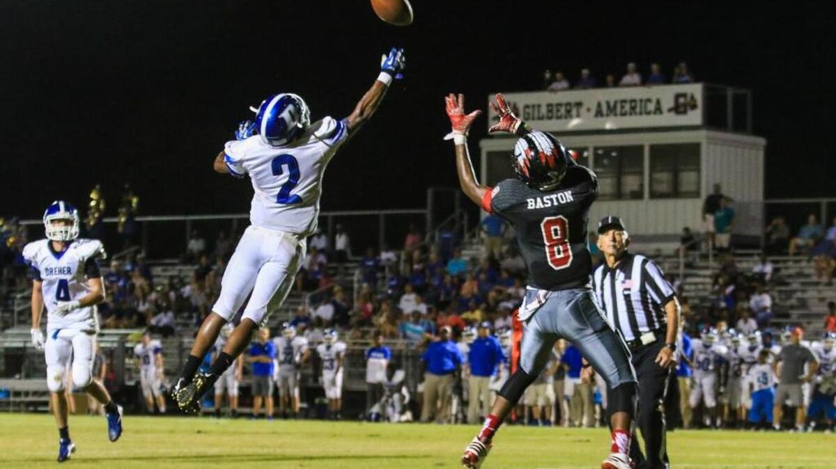 Dreher's Anthony Salters (2) knocks down a pass intended for Gilbert's Ray Baston (8) during the game against at Gilbert Friday night.
