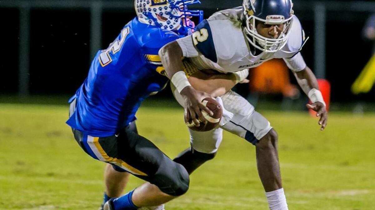 Blythewood Bengals quarterback David Isreal (2) is sacked by Lexington Wildcats defensive lineman Mason Mauldin (52) in the first half of the game between the Blythewood Bengals and the Lexington Wildcats at Lexington High School.
