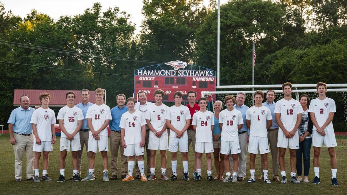Hammond boys soccer family (L to R): Michael Schraibman (Class of ‘83) and Michael Schraibman (Class of ‘20); No. 25 Wade Oliver (Class of ‘20), Hampton Oliver (Class of ‘85) and No. 11 Rex Oliver (Class of ’17); Thorne Barrett (Class of ‘90) and No. 14 Lake Barrett (Class of ‘19); Jenkins Mikell (Class of ‘85) and No. 6 Isaac Mikell (Class of ‘18); No. 9 Ross Moore (Class of ’17), Martin Moore (Class of ‘88) and No. 24 John Bailey Moore (Class of ‘20); Anne Cely Fowler (Class of ‘90) and No. 19 Meade Fowler (Class of ‘19) and Will Fowler (Hammond Alumni); No. 1 Sumpter Clarke (Class of ‘19) and Edward Clarke (Class of ‘88); No. 12 Lucas Prickett (Class of ‘18), Melissa Prickett (for husband Dalton Prickett, Class of ’79 -- on Medical Mission trip to Haiti) and No. 2 Austin Prickett (Class of ’18)