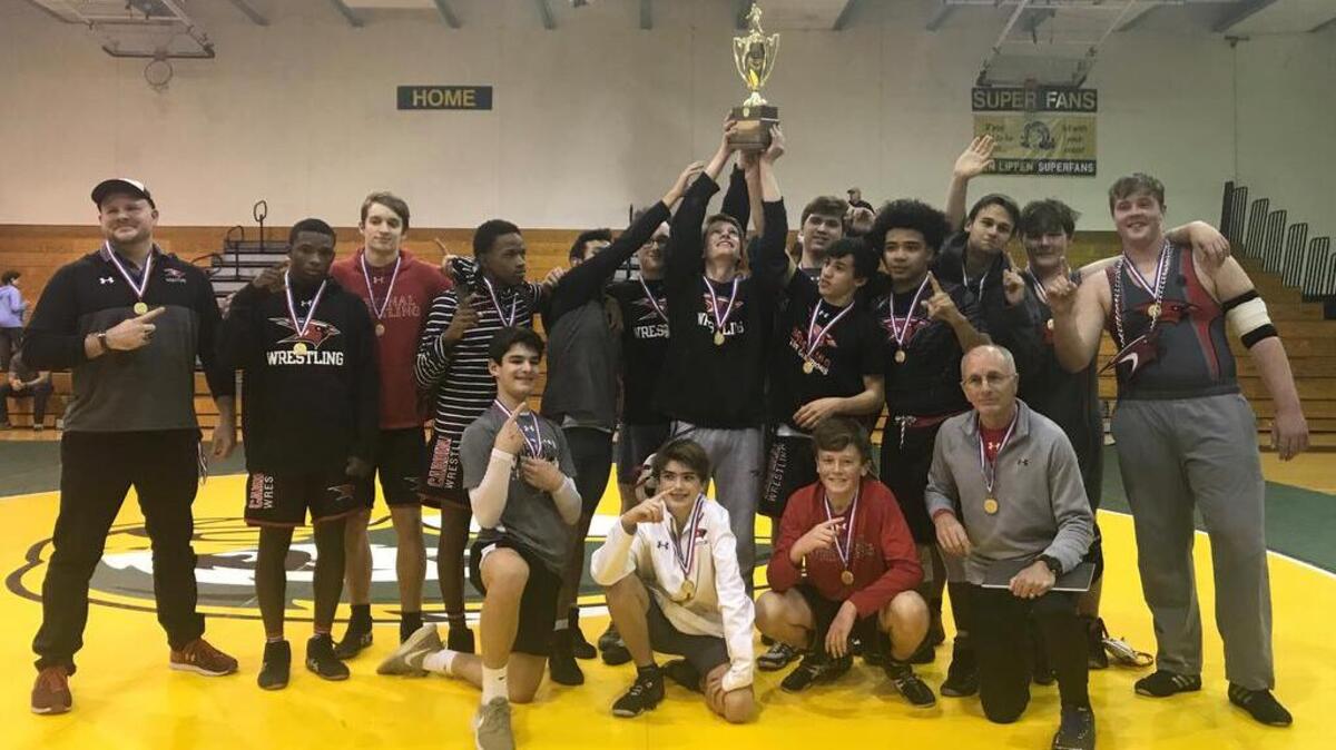 Cardinal Newman’s wrestling team celebrates its fifth consecutive SCISA Class 3A state championship.
