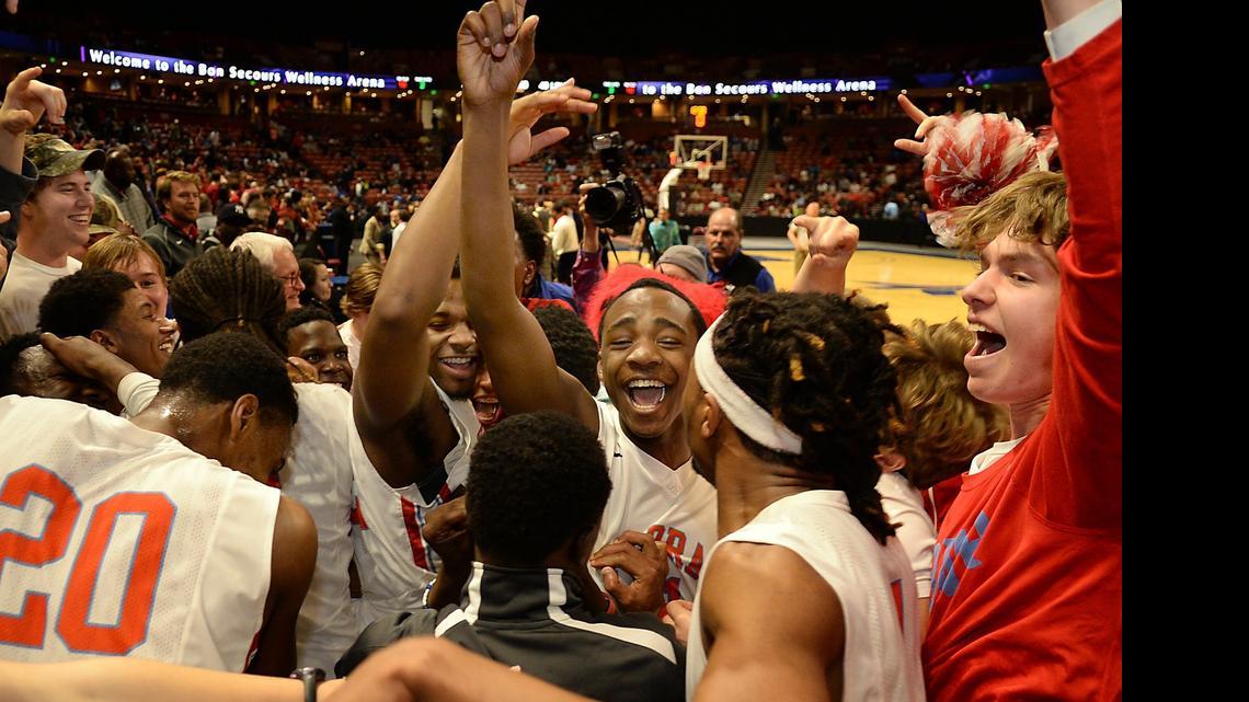 
AC Flora's Karl Gamble (20) and teammates celebrate with fans. Monday, March 2, 2015. 
