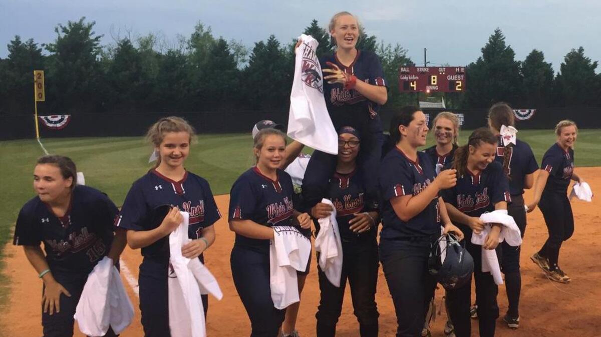 The White Knoll softball team celebrates their win over Wando in the Lower State Championship game Friday.