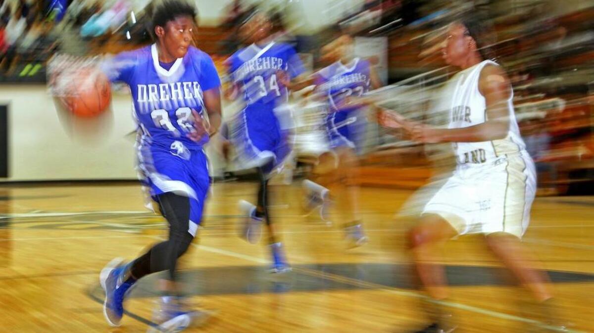 Dreher’s Kamryn Lemon looks to pass as she drives to the hoop against Lower Richland on Tuesday.