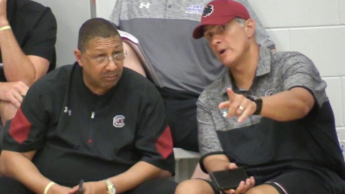 USC head basketball coach Frank Martin talks with assistant Perry Clark while watching high school basketball phenom Zion Williamson play at the Adidas cam in Spartanburg.