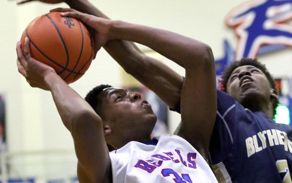The third round of the 4A basketball playoff put Blythewood against Byrnes in a one and two seed match up at Byrnes high school on Tuesday evening of Feb. 23, 2016. Byrnes won 75-55. Kailyn Williams of Byrnes is fouled by Keith Williams (2) of Blythewood.