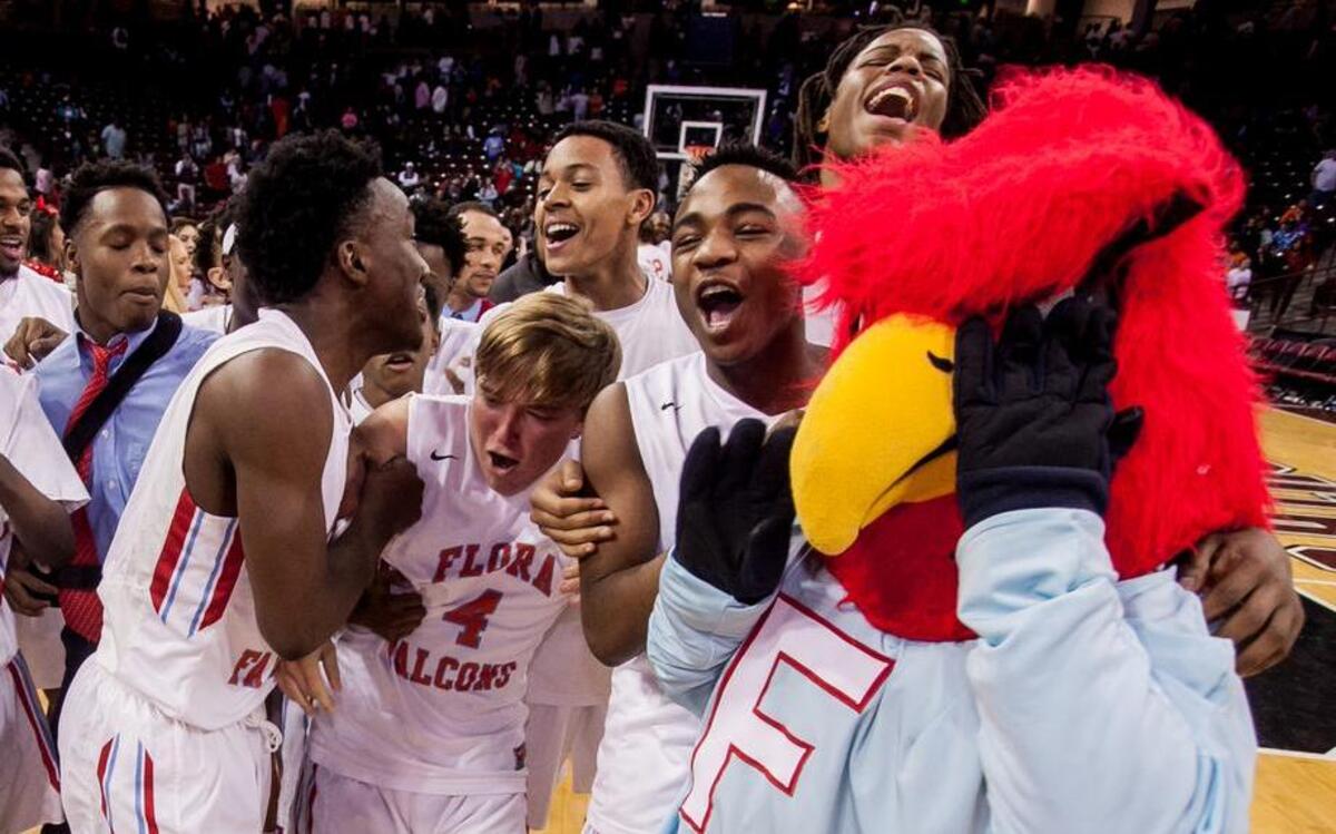 A.C. Flora High School players celebrate following their win over Midland Valley High School in the 2016 3A Boys State Championship game at Colonial Life Arena.