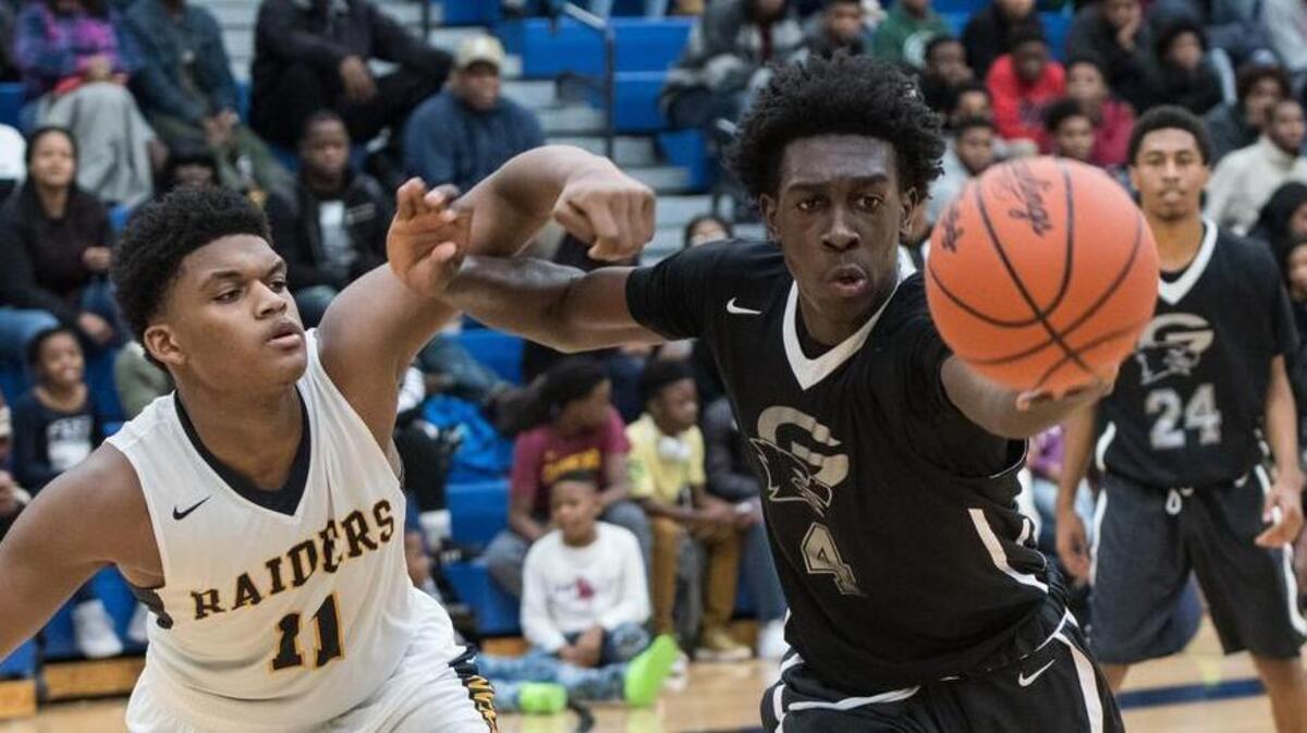 Keenan's Dillon Jones (11) and Gray's Juwan Gary (4) both go after a loose ball during a game last season. The two teams will play on the first day of the Chick-fil-A Classic on Dec. 20.