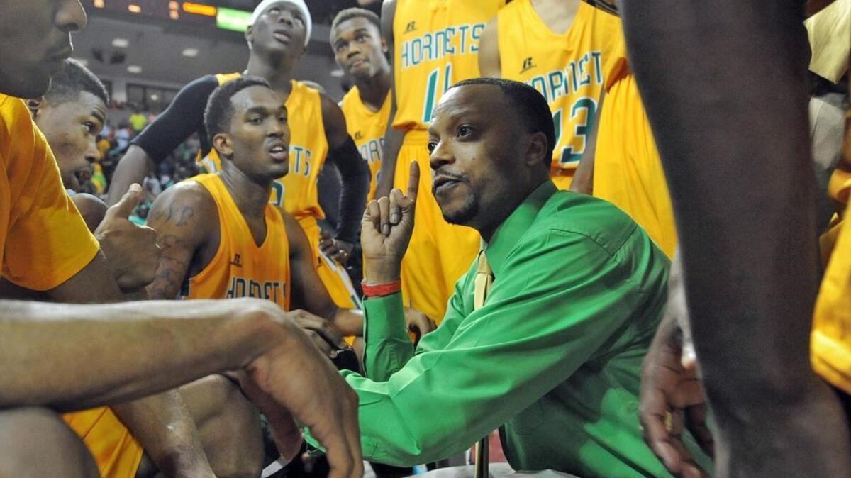 Daryl Jarvis coaches the C.A. Johnson boys basketball team.