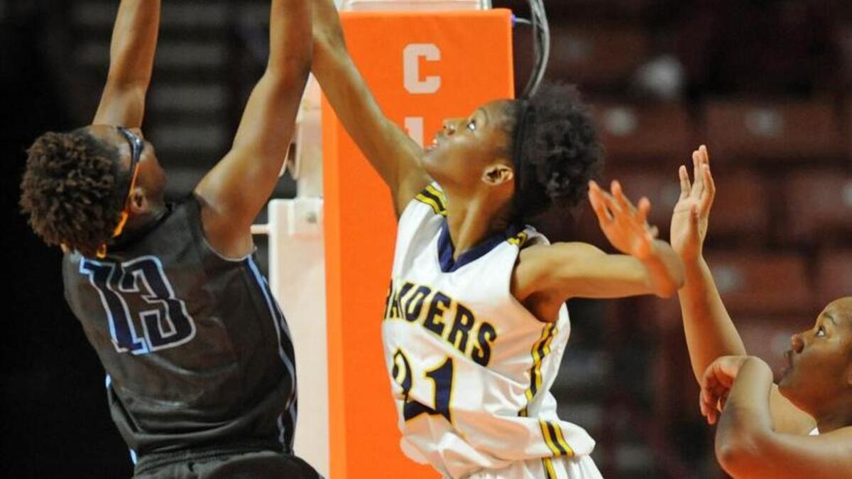 Keenan’s Le'on Hill blocks the shot of Newberry’s Nigeria Davis during the Raiders’ win in the Upper State finals. Keenan faces Bishop England for the 2A state title on Saturday.
