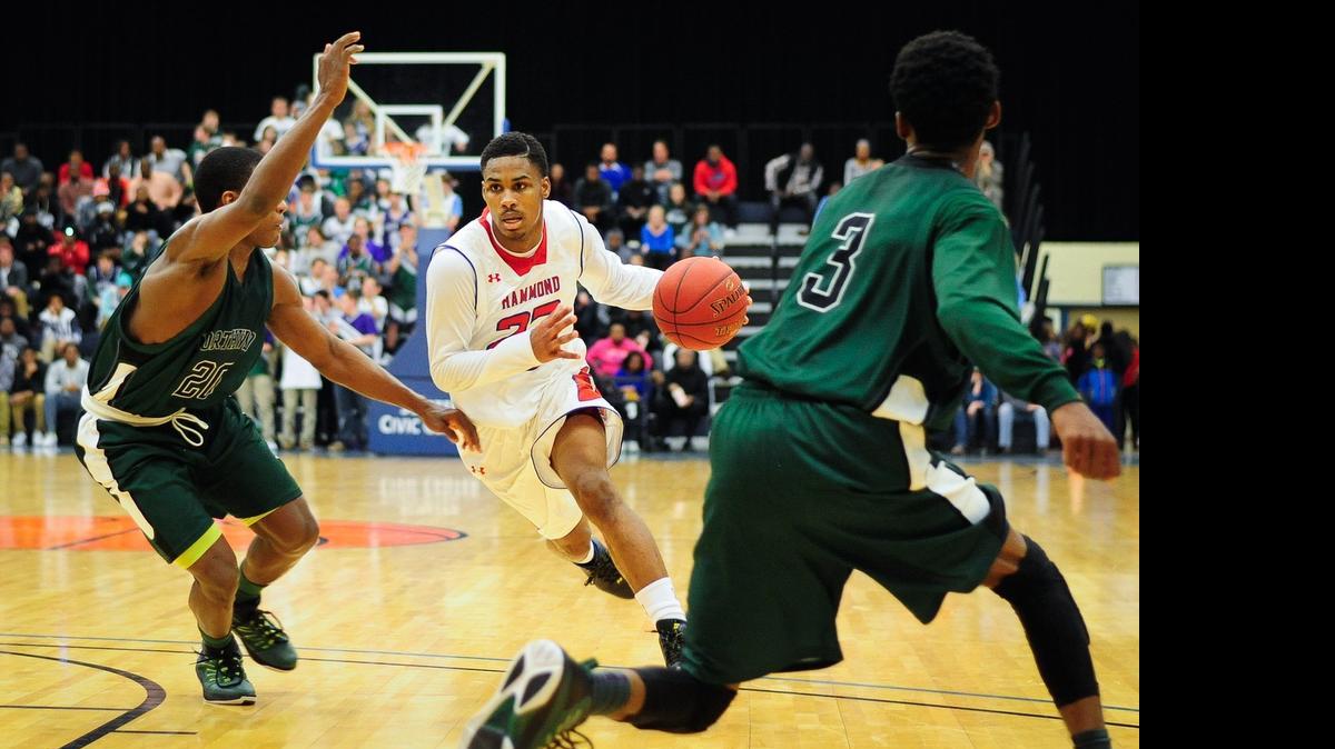 
Hammond's Seventh Woods drives to the basket in the first half of Saturday night's Class 3A state championship game against Northwood.
