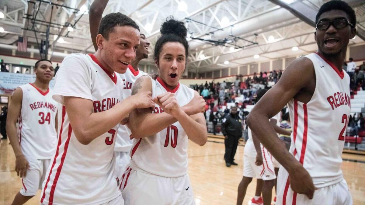 Westwood's Tyrell Huff (5), Darius Colmeman (10) and Kendall Wormack, right, celebrate their win against Ridge View at Westwood High School on Friday.