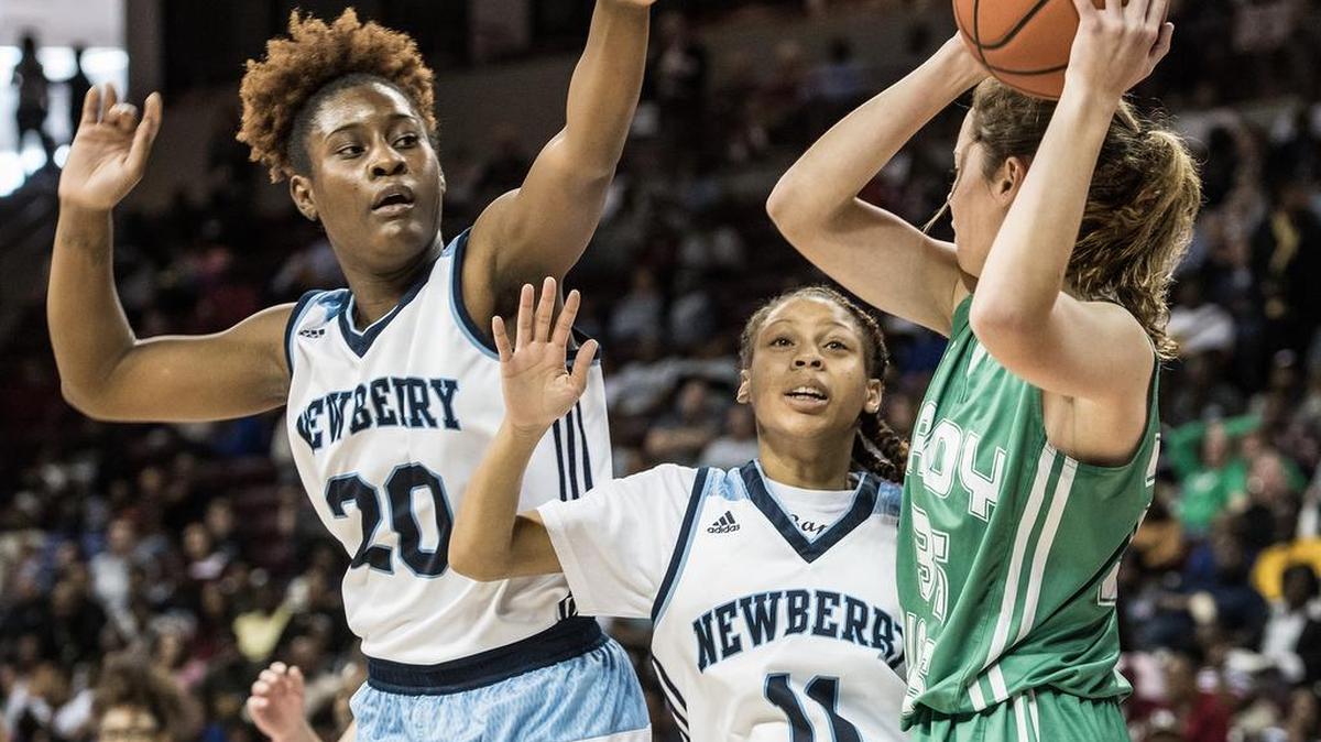 Newberry's Kelsey Felks (20) and Zacharia Epps (11)