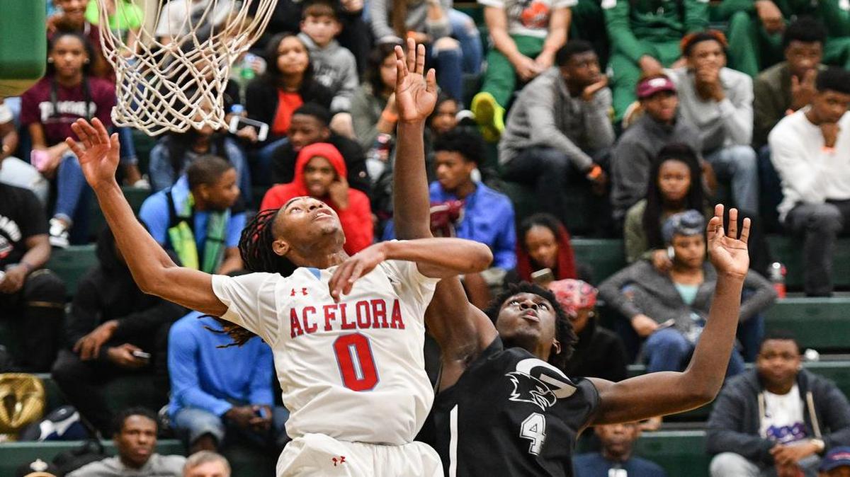 A.C. Flora's James Reese (0) and Gray Collegiate's Juwan Gary (4)