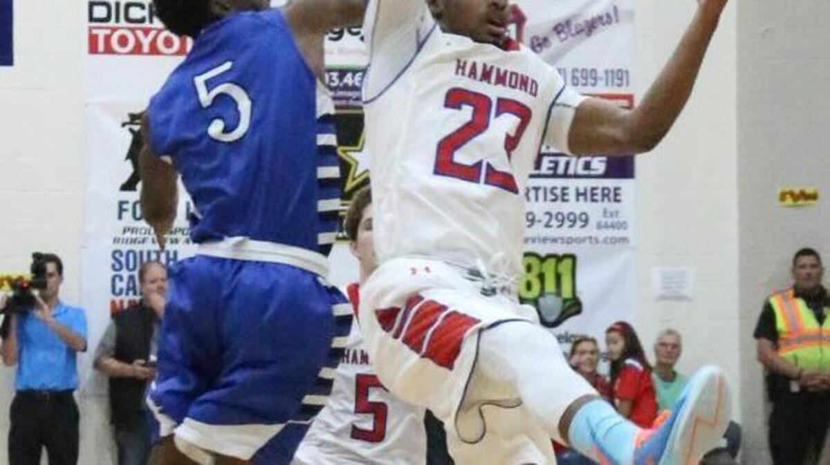 Hammond’s Seventh Woods (23) grabs a high pass over Dreher’s Tyrod Hutcherson during the first half of the Bojangles’ Bash Friday night at Ridge View High School.