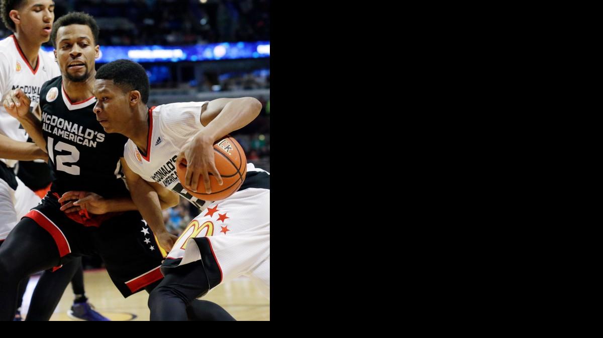 
Spring Valley’s PJ Dozier drives as East point guard Isaiah Briscoe defends during the McDonald's All-American game on Wednesday. 
