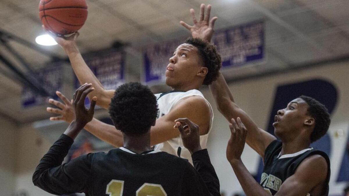 Onteus Anderson of Gray Collegiate drives to the hoop against Richland Northeast's Savion Townsend during the first half of the Bojangles Bash Thursday night at Ridge View High School.