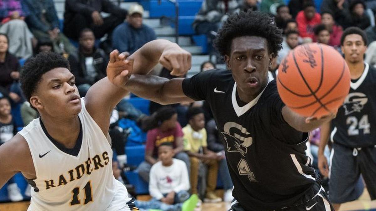 Gray Collegiate’s Juwan Gary (4) and Keenan's Dillon Jones (11) both go after a loose bouncing ball during the second half of their game last season. Gray is ranked No. 1 in Midlands Top 10 poll and faces Keenan on Wednesday in the Chick-fil-A Classic.