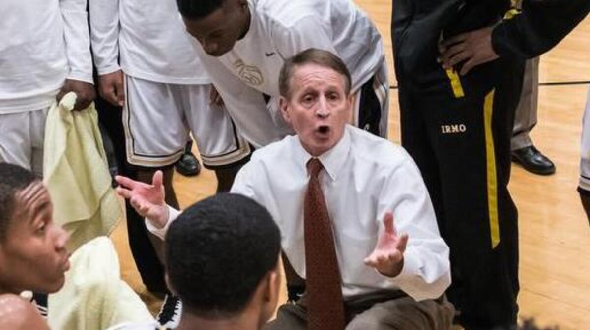Irmo's coach Tim Whipple goes over game plans during a timeout of last year’s Class 5A playoff game against West Florence.
