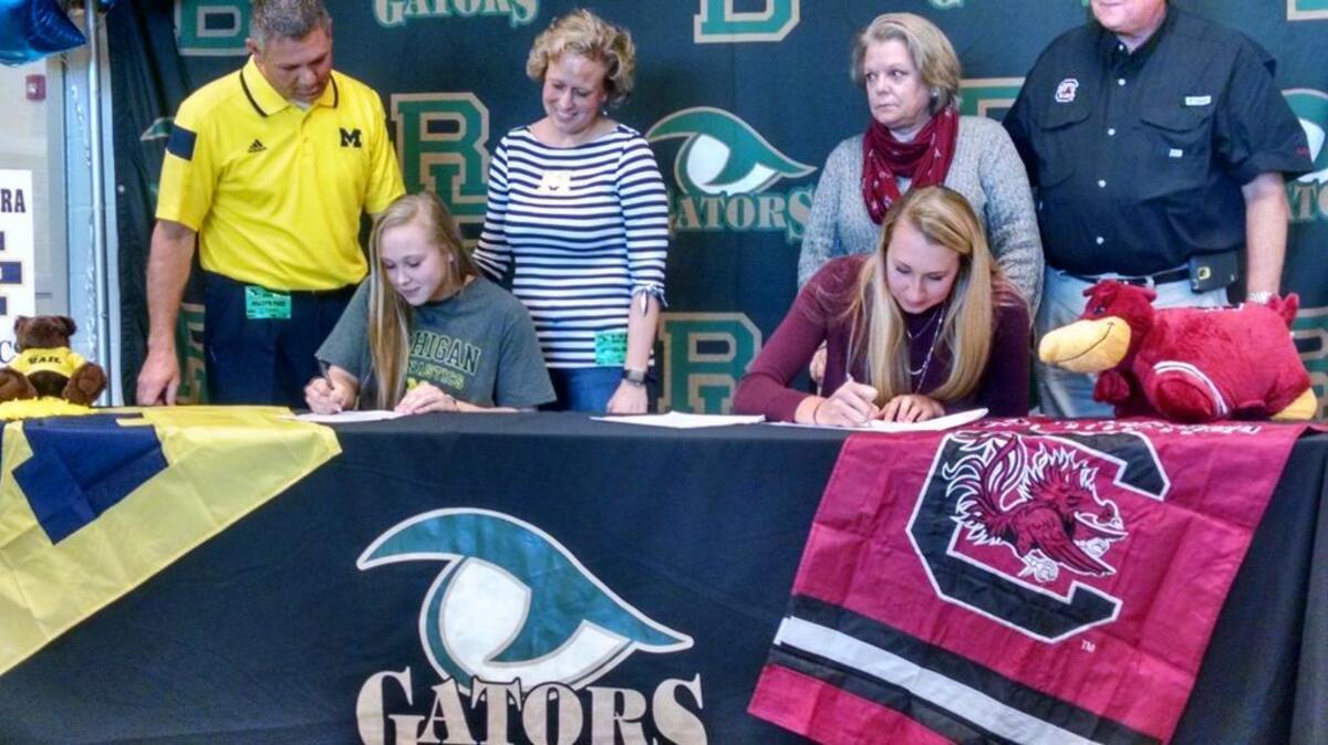 River Bluff’s Maggie O’Hara signs her letter of intent to play gymnastics at Michigan, and Claire Edwards signs to play volleyball at South Carolina.