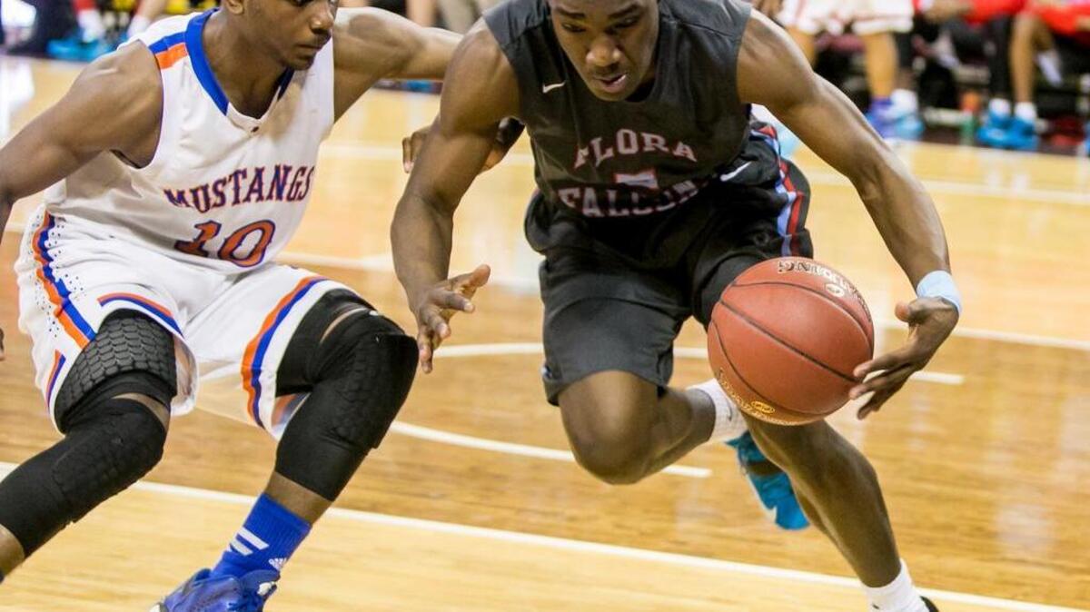 A.C. Flora guard Kendale Hampton (5) steals an inbound pass from Midland Valley guard Daniel Carr (10) in the second half of the Class 3A Boys State Championship game at Colonial Life Arena.