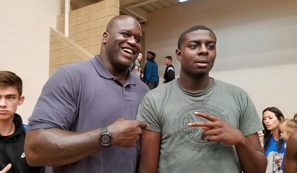 Shaquille O’Neal poses for a photo with a fan Friday at Nike Peach Jam in North Augusta.