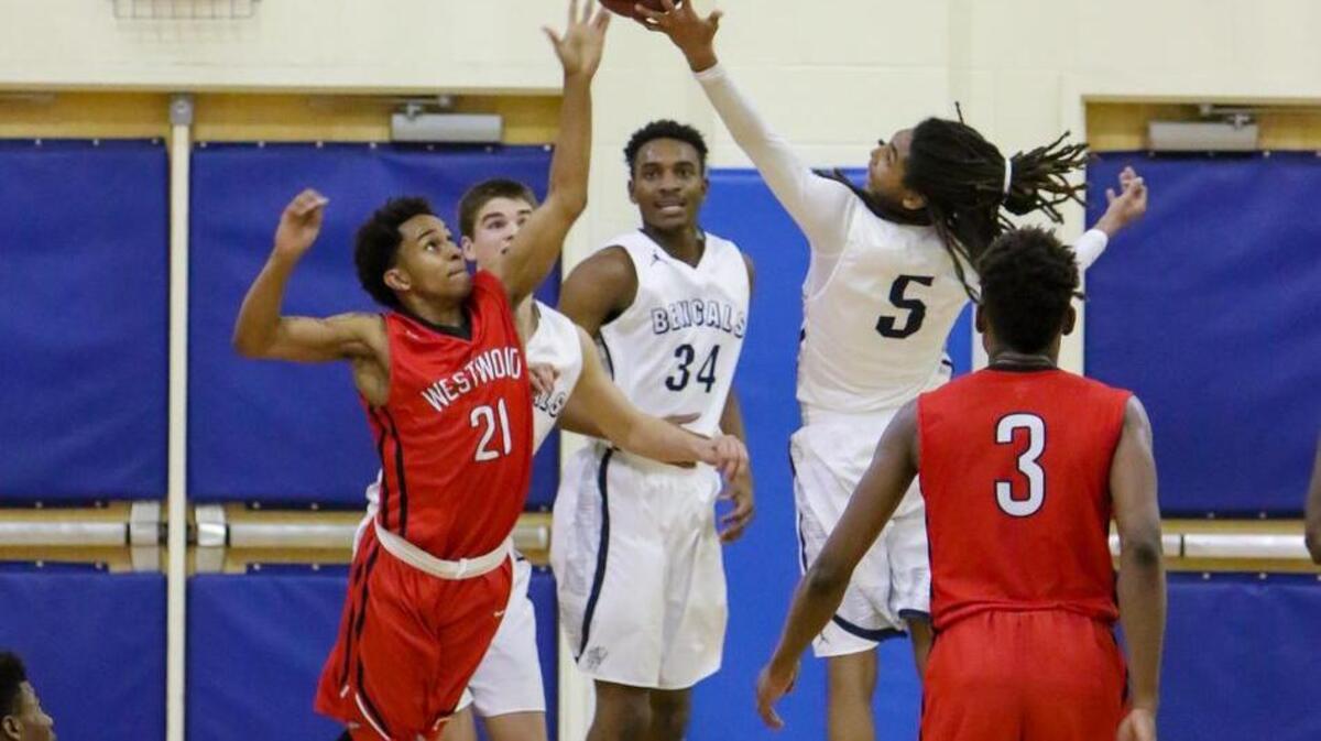 Westwood’s Tyree Lee (21) fights Blythewood’s Josh Bowers (5) for a rebound during their game at Blythewood on Tuesday night.