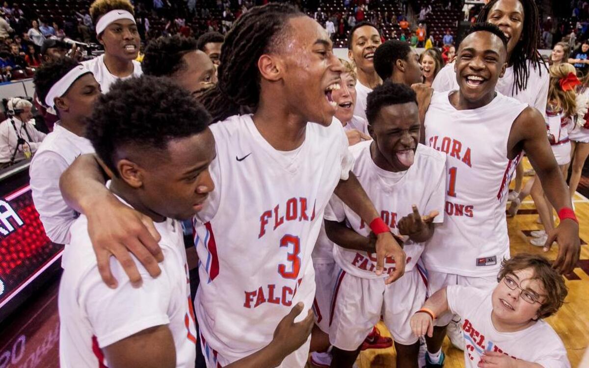 A.C. Flora boys basketball players celebrate thier Class 3A Boys State Championship in March.
