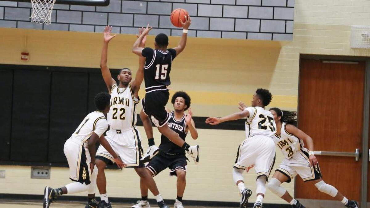 Richland Collier of the Carolina Forest Panthers leaps into the air to take a shot against the Irmo Yellow Jackets.