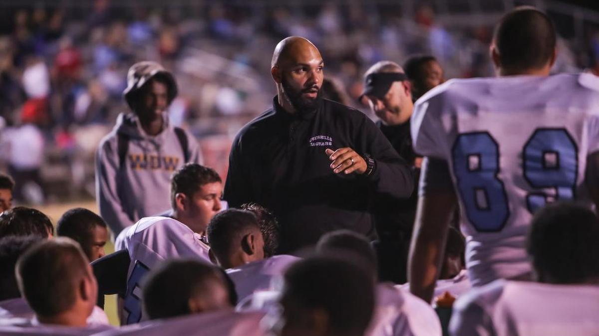 Overhills High School Coach, Rodney Barr, talks to players at the Seventy First Homecoming Football game on Oct. 17th, 2014.