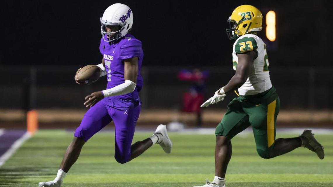 Andre Washington of Ridge View High School gets driven out of bounds by Justin Nelson of Spring Valley High School during Ridge View’s game against visiting Spring Valley on Friday, October 8, 2021.