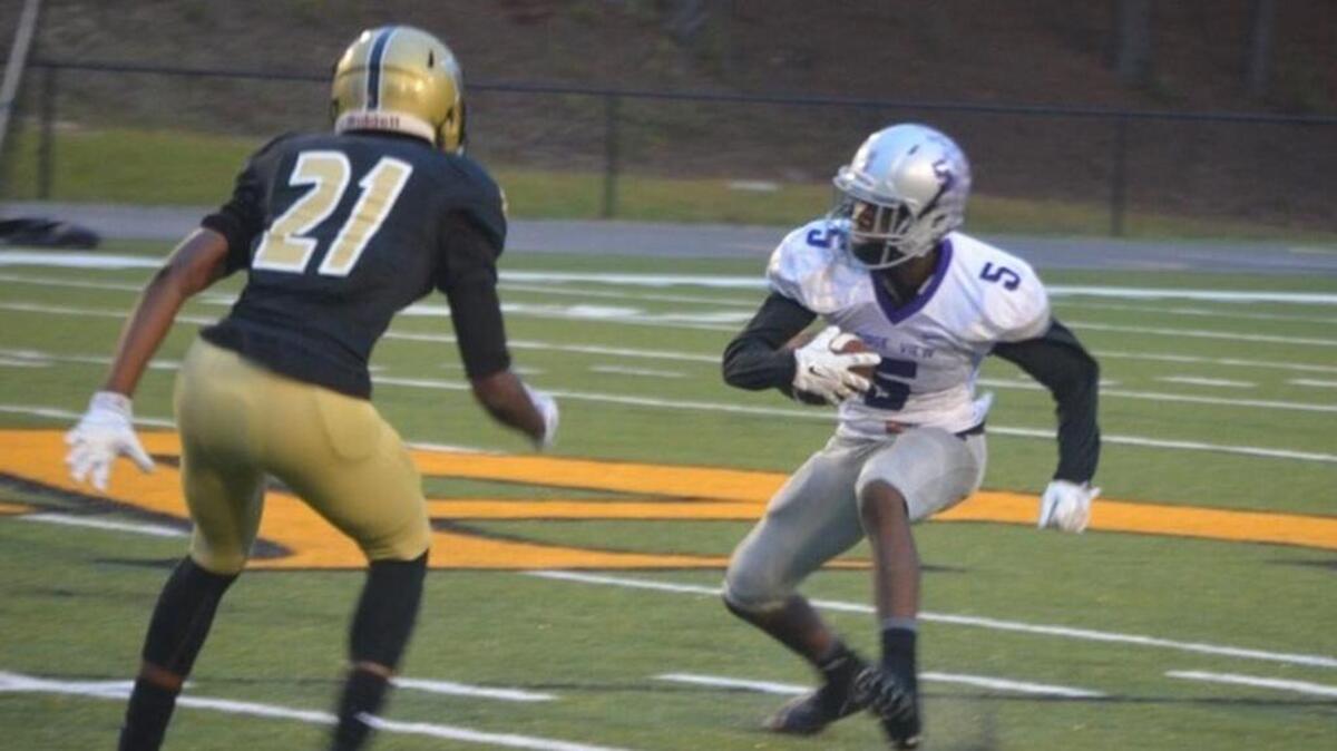 
Ridge View's Dinichie Ashe returns an interception while North Augusta's Brent Coach (21) looks to make a tackle. 
